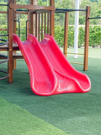 children's playground with artificial turf kids jungle gym and double red slide capitol turf pros