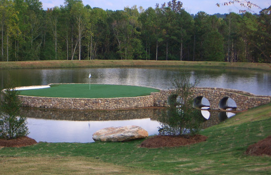 private backyard putting green in potomac, MD on a pond