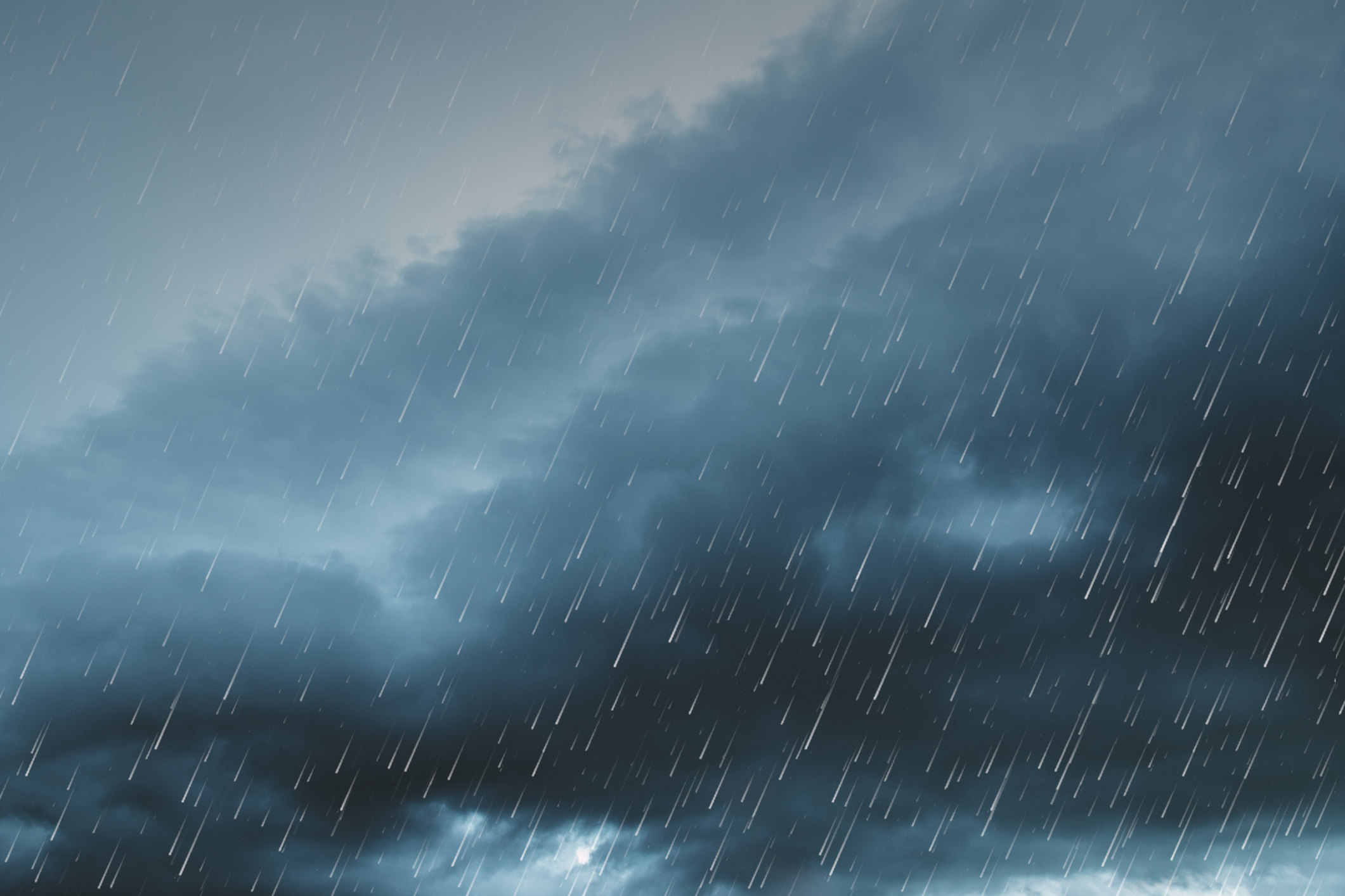 A cloudy dark sky and heavy rain for artificial-turf-during-heavy-rain-or-flooding blog.